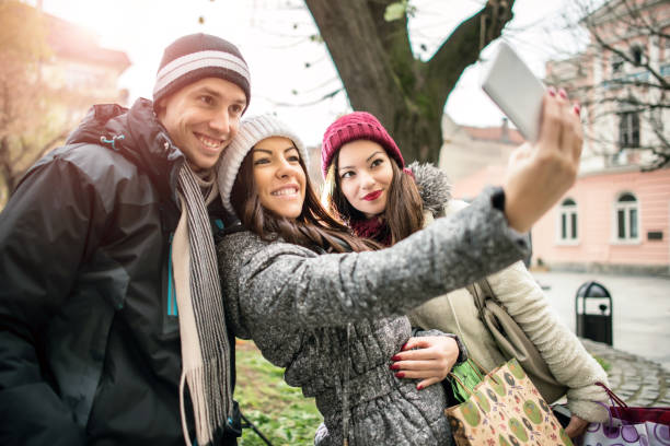 istock Friends having fun outdoors in winter city. 1051139584