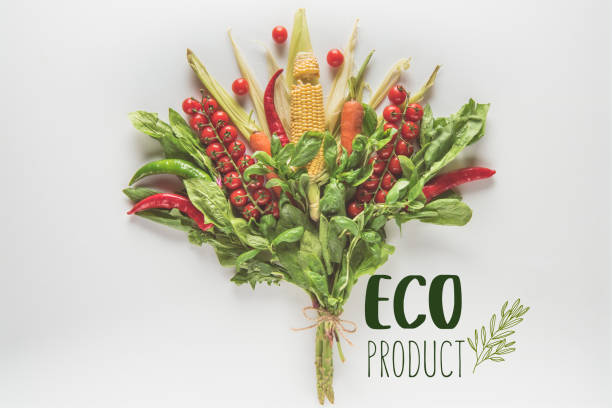 bouquet of corn cob, spinach, basil, cherry tomatoes and chili peppers isolated on white with 