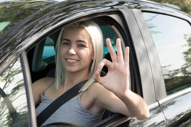 istock Young girl driving a car 1051155142