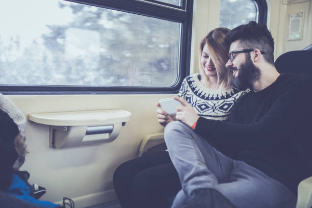 istock Happy couple traveling by train 1051160110