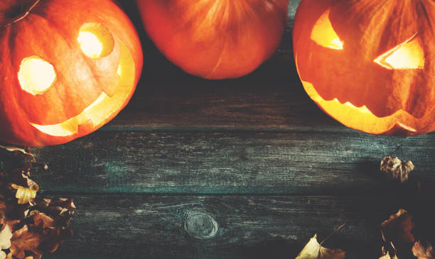 istock orange pumpkins for halloween with spooky faces 1051160258