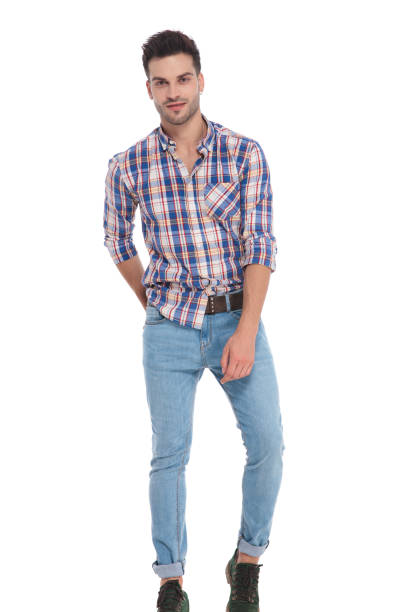 istock smiling man wearing checkered shirt and jeans standing 1051161112