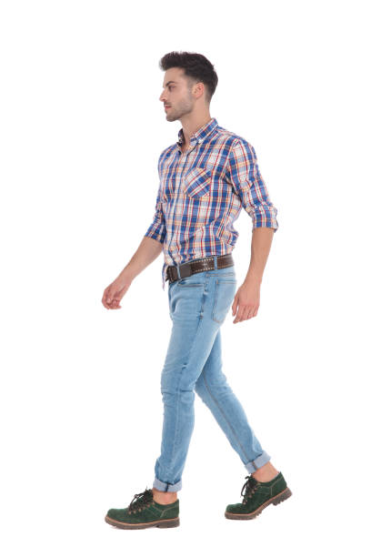 istock man wearing a shirt with red checkers walks to side 1051161128