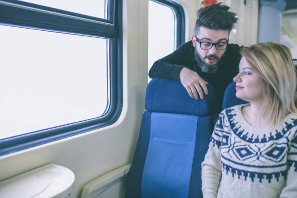 istock Happy couple traveling by train 1051165540
