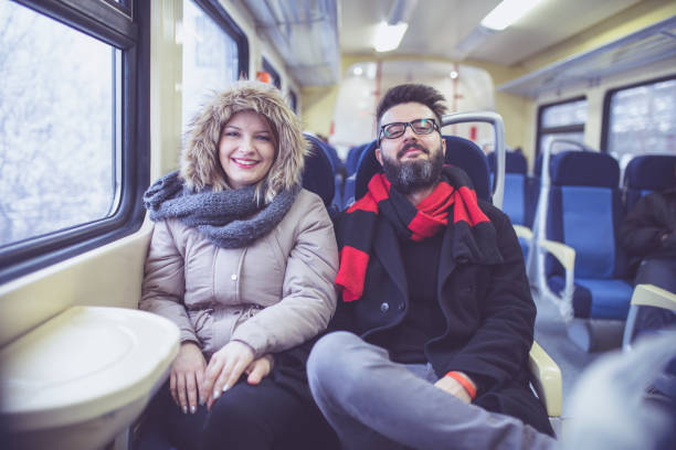 istock Happy couple traveling by train 1051166668