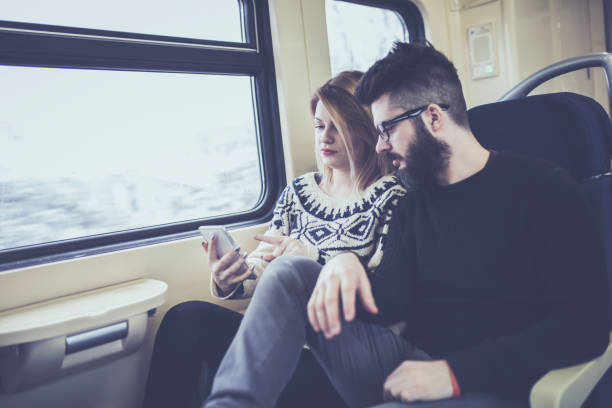 istock Happy couple traveling by train 1051167060