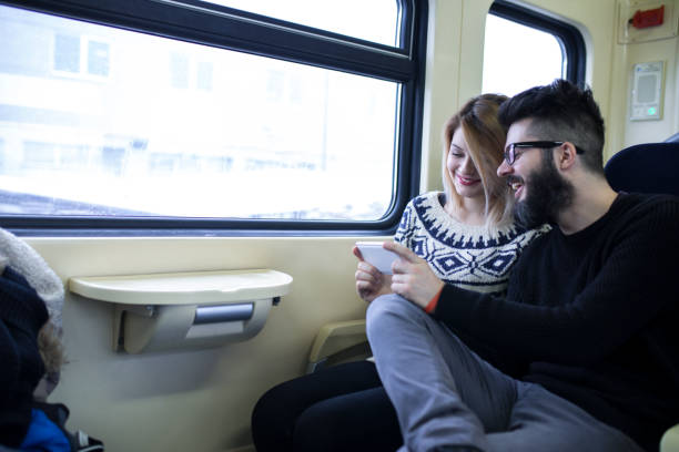 istock Happy couple traveling by train 1051167522