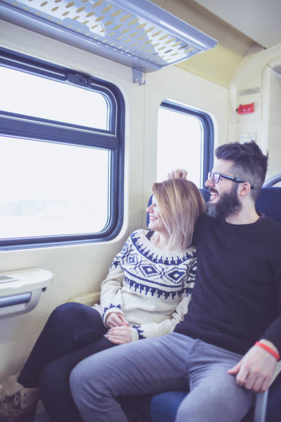 istock Happy couple traveling by train 1051169814