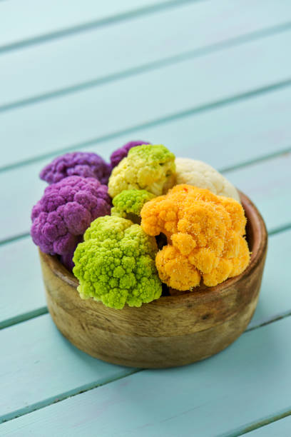 istock cauliflower of different colors in a boxwood bowl 1051175512