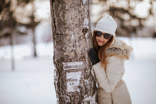 Beautiful young woman enjoying winter