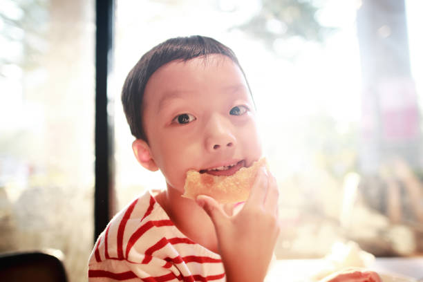 istock Children eat roast chicken wings 1051176626