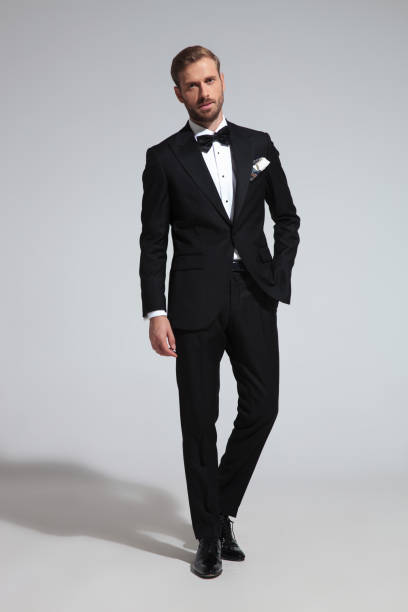 istock young elegant groom in tuxedo and bowtie 1051180166