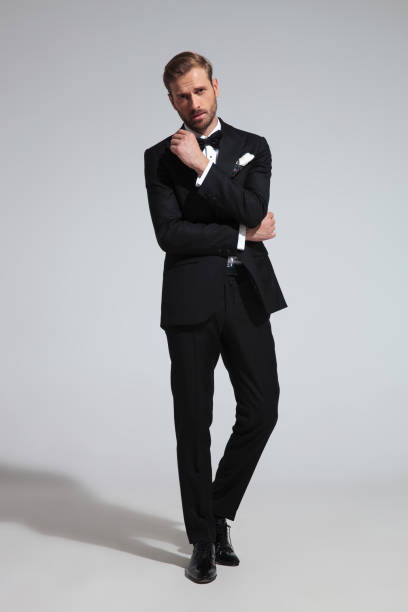 istock young thoughtful elegant man in tuxedo and bowtie 1051180206
