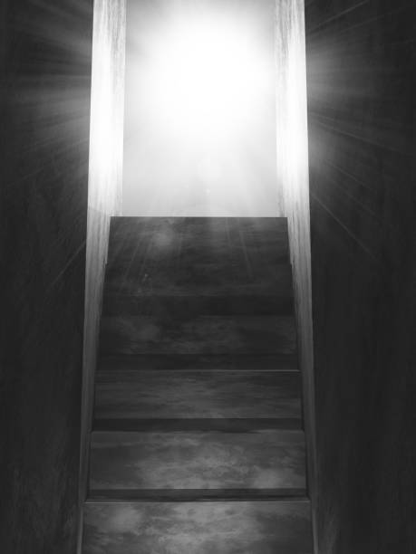 istock 3D old concrete stairs leading to an open door with sun rays 1051180248