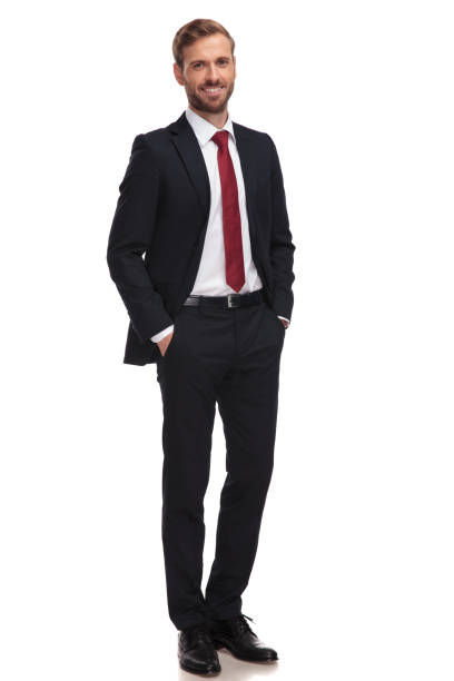 istock relaxed businessman smiling and standing with hands in pockets 1051180604