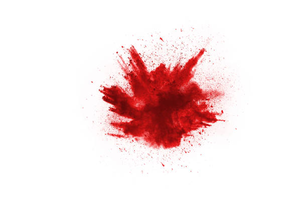 istock Freeze motion of red powder exploding, isolated on white background. Abstract design of red dust cloud. Particles explosion screen saver, wallpaper 1051180986