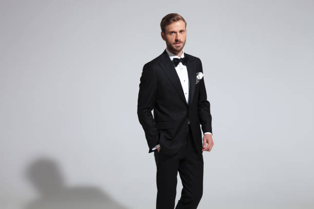 istock young elegant man wearing tuxedo and bowtie 1051181184