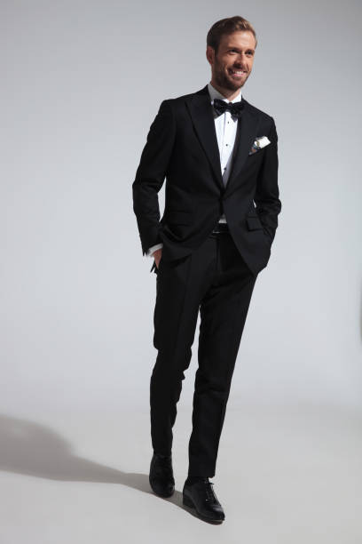 istock side view of a walking elegant man in tuxedo laughing 1051181292