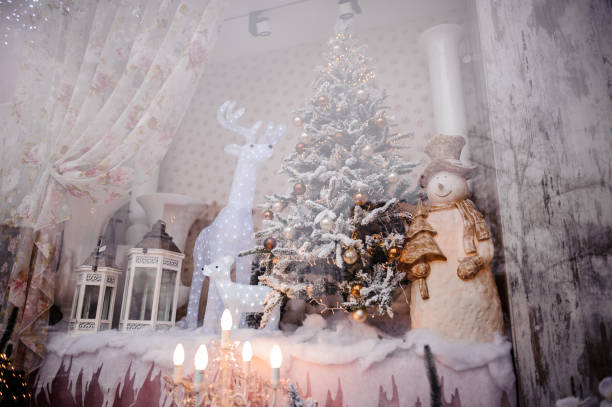 istock Festive Christmas storefront with decorated artificial Christmas trees and toys 1051190082