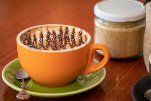 istock Latte and cappuccino or mocha coffees on a table in a cafe setting 1051191642