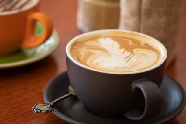 istock Latte and cappuccino or mocha coffees on a table in a cafe setting 1051191724