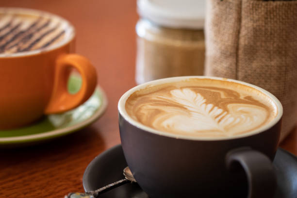 istock Latte and cappuccino or mocha coffees on a table in a cafe setting 1051191760