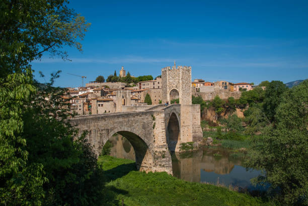 istock Medieval bridge over river El Fluvia near Besalu, Spain 1051192098