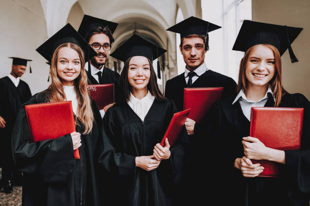 istock Group of Students. Mantles. Standing. Corridor. 1051195748