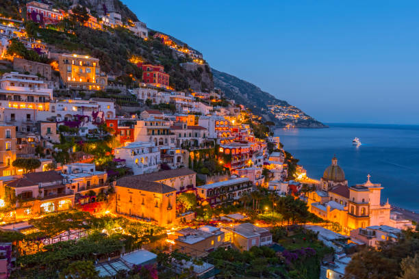Night view of Positano village at Amalfi Coast, Italy. stock photo