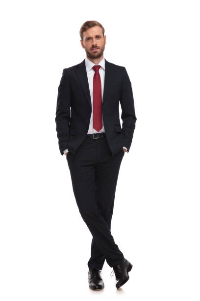 istock sad businessman stands with hands in pockets on white background 1051205446