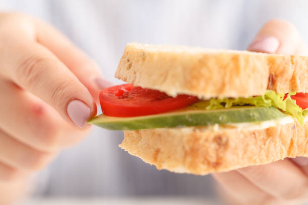 istock healthy sandwich  in wonen hands 1051206102