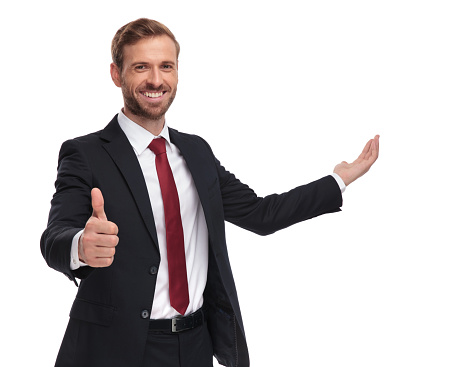 portrait of smiling businessman making ok sign and inviting