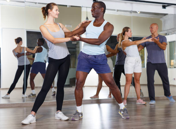 istock Friendly   people dancing samba in pairs 1051207300