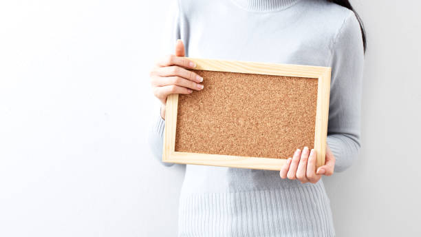 istock young attractive asian woman having a Bulletin Board 1051207746