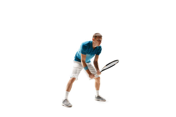 istock one caucasian man playing tennis player isolated on white background 1051215798