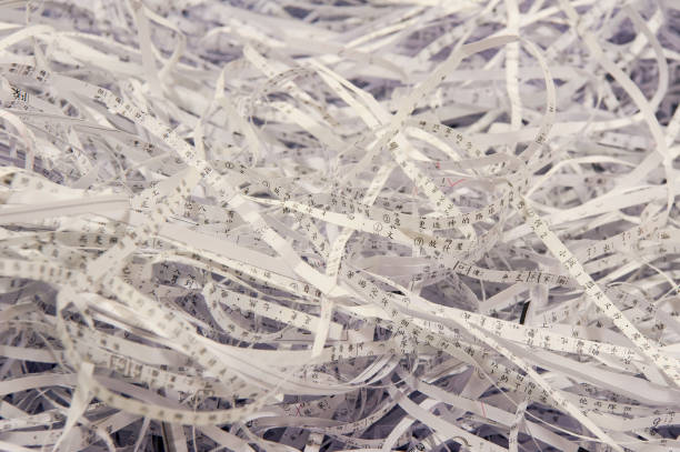 istock Use a shredder to dispose of discarded paper fragments 1051223320