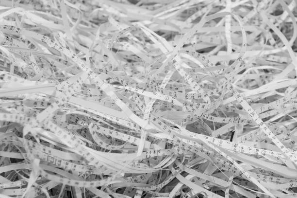istock Use a shredder to dispose of discarded paper fragments 1051223328
