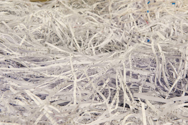 istock Use a shredder to dispose of discarded paper fragments 1051223356