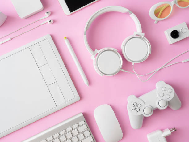 istock top view of office desk workspace with smartphone, notebook, graphic tablet, keyboard and mouse on pink color background, graphic designer, Creative Designer concept. 1051224926