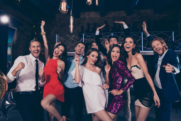 istock Happy 2019! Beautiful attractive pretty glamorous gorgeous magnificent charming glad ecstatic ladies and handsome gentlemen, cocktail party, chill out at fashionable night club 1051227326