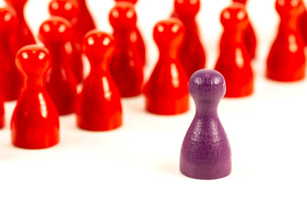 istock single purple halma cone against red halma cones indicating majority ratios and group constelation 1051227976