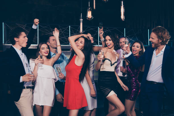 istock Nice cool bright vivid shiny attractive beautiful charming slim  glamorous winsome cheerful delight ecstatic ladies and handsome gentlemen, chill out at fasionable night club 1051228056