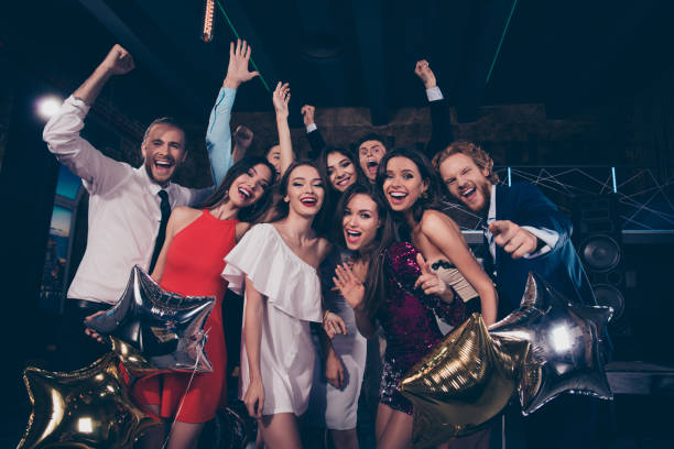 istock Low angle view of nice beautiful adorable pretty glamorous gorgeous charming cheerful ecstatic crazy ladies and handsome gentlemen, cocktail party, chill out at night club, air baloons 1051229134