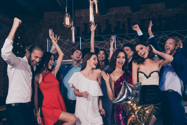 istock Happy 2019! Beautiful attractive pretty glamorous gorgeous magnificent charming glad ecstatic ladies and handsome gentlemen, cocktail party, chill out at fashionable night club 1051232806