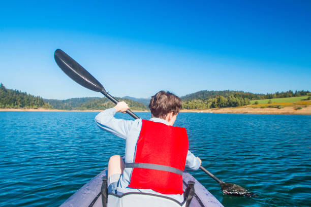 istock Woman kayaking on lake 1051233292