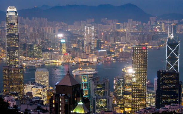 istock Large Cruise ship sails through Victoria Harbour 1051235676
