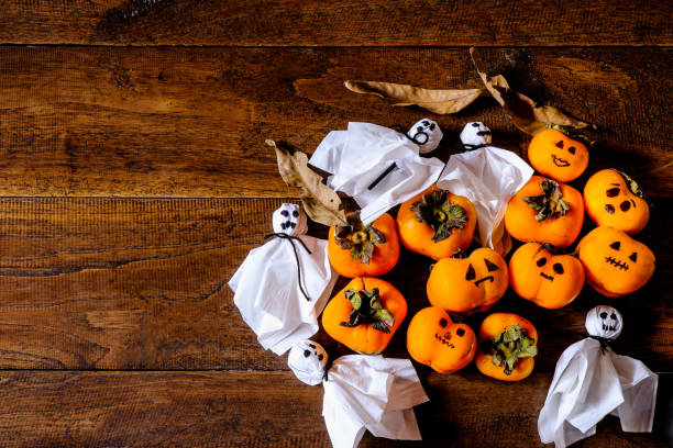 istock Pumpkins and ghosts on Halloween 1051241224