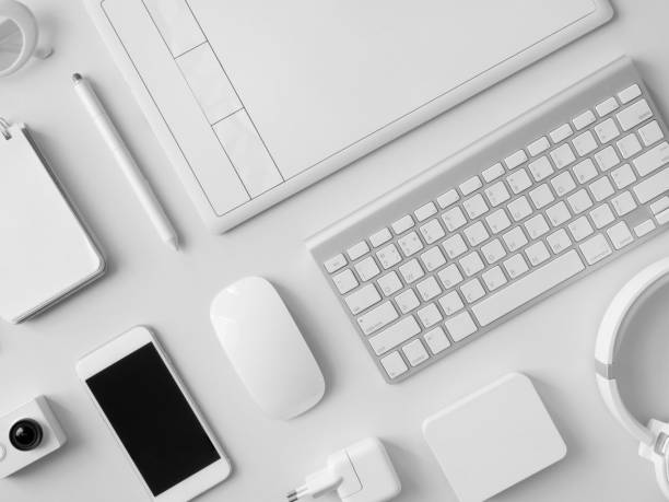 top view of office desk workspace with notebook, graphic tablet, smartphone and gadget on table background, graphic designer, Creative Designer concept.