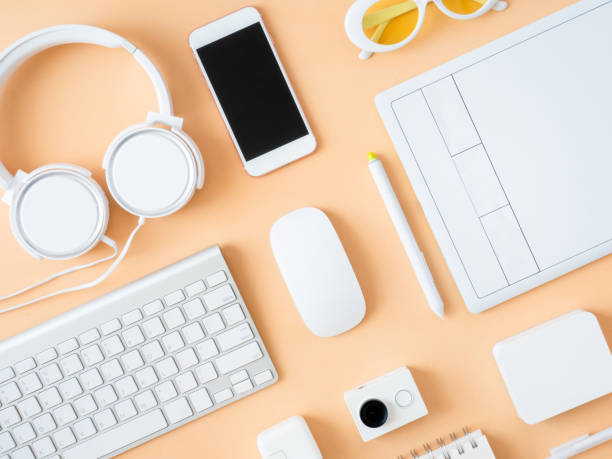 istock top view of office desk workspace with notebook, graphic tablet, smartphone and gadget on table background, graphic designer, Creative Designer concept. 1051244010