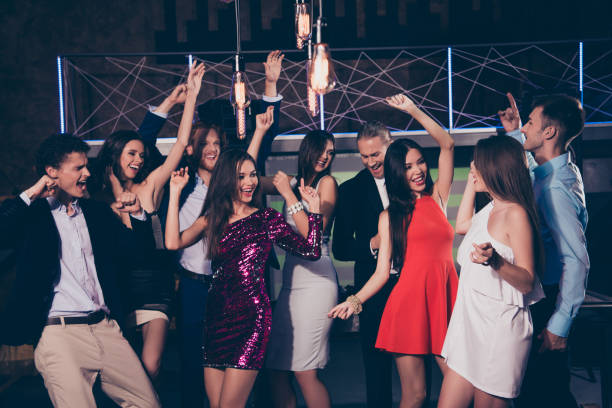 istock Beautiful nice exquisite adorable attractive cool bright elegant cheerful glad excited stylish trendy ladies and gentlemen at cocktail party, chill out at fashionable night club 1051245068